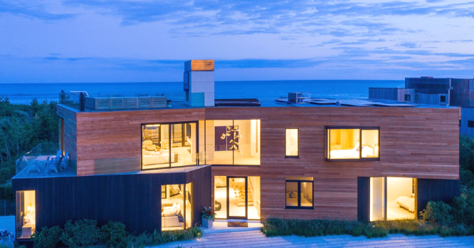 A home exterior with a view of the ocean in the background