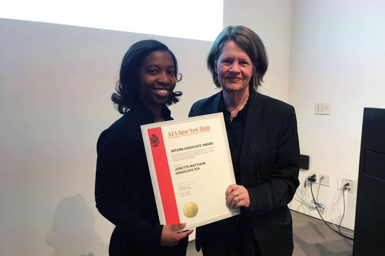 Josette Matthew, Associate AIA, Project Coordinator, Tall Builders, accepts the AIA New York State Intern-Associate Award from Jane Smith, FAIA, IIDA. Image credit: Angie Vasquez.