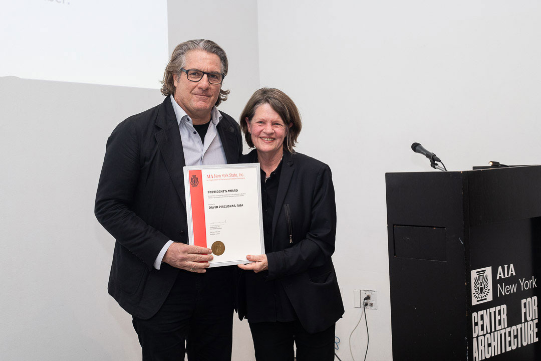 David Piscuskas, FAIA, Founding Principal, 1100 Architect, accepts the AIA New York State President’s Award from Jane Smith, FAIA, IIDA. Photo: Angie Vasquez.