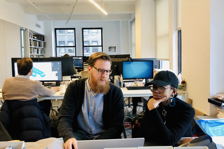 Altria Ayinde receives a computer software tutorial at Bernheimer Architecture. Image courtesy of Bernheimer Architecture.