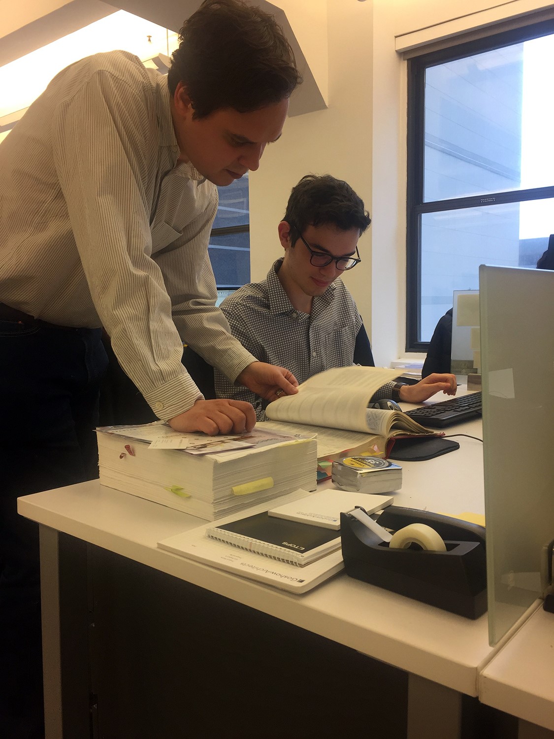 Benjamin Sokolow receives a computer software tutorial at Goshow Architects.