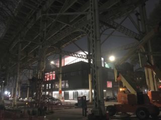 The new Madison Square Boys & Girls Club in Harlem, by Rogers Partners, can be seen glowing from beneath the 155th Street Viaduct.