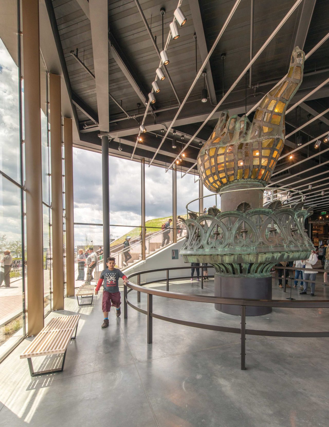 A highlight of the exhibitions is the original torch, installed in a gallery with 22-foot-high glass walls. The museum opened to the public on May 16.