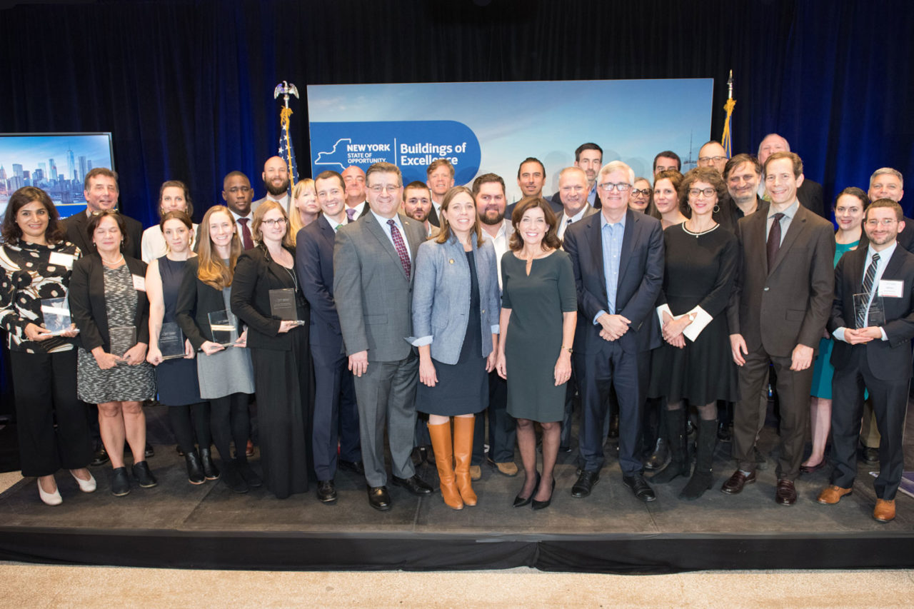 Winners are pictured with (left to right) Brendan Hall (ASHRAE), Mark Kruse (AIA New York State), Alicia Barton (NYSERDA), Lt. Governor Kathy Hochul, Senator Brian Kavanagh (New York State’s 26th District), Richard Yancy (Building Energy Exchange) at the Buildings of Excellence Award Ceremony at the Building Energy Exchange in the Surrogate's Courthouse. Photo: Dan Creighton/DanCreighton.com.