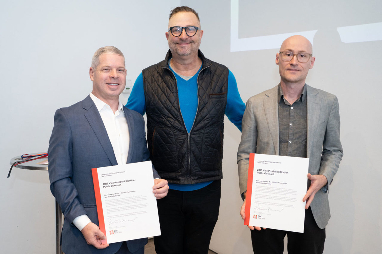 Scott Hensen, AIA, and Matthew Radune, AIA, both of Scott Henson Architect, accept the VP for Public Outreach Citation from Matt Bremer, VP for Public Outreach, in recognition of "How Low Can We Go – Historic Preservation and Carbon Reduction," a joint program by the AIANY Historic Buildings Committee and the Committee on the Environment. Photo: Samuel Lahoz.