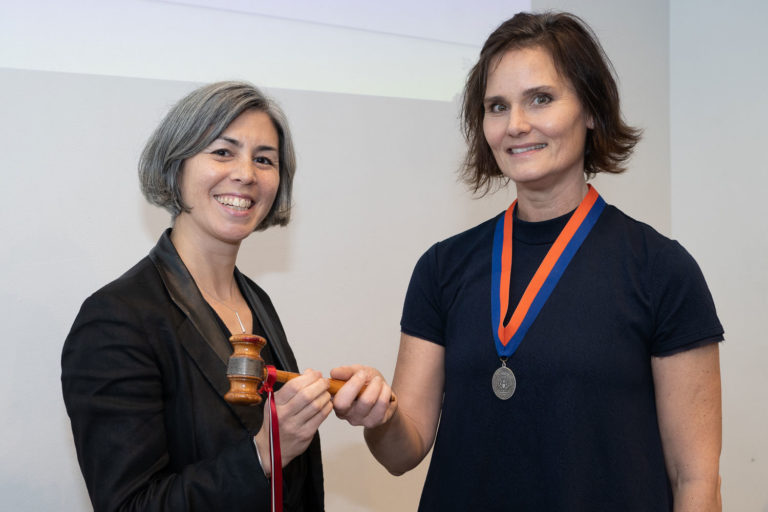 Incoming AIANY President Kim Yao, AIA, accepts the gavel from Hayes Slade, AIA, 2019 AIANY President. Photo: Samuel Lahoz.