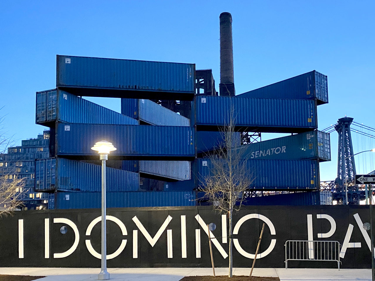 TRIANGLE STACK #2 by LOT-EK and JR, on view at Domino Park. Photo: Marc Azoulay ©JR-ART.net.