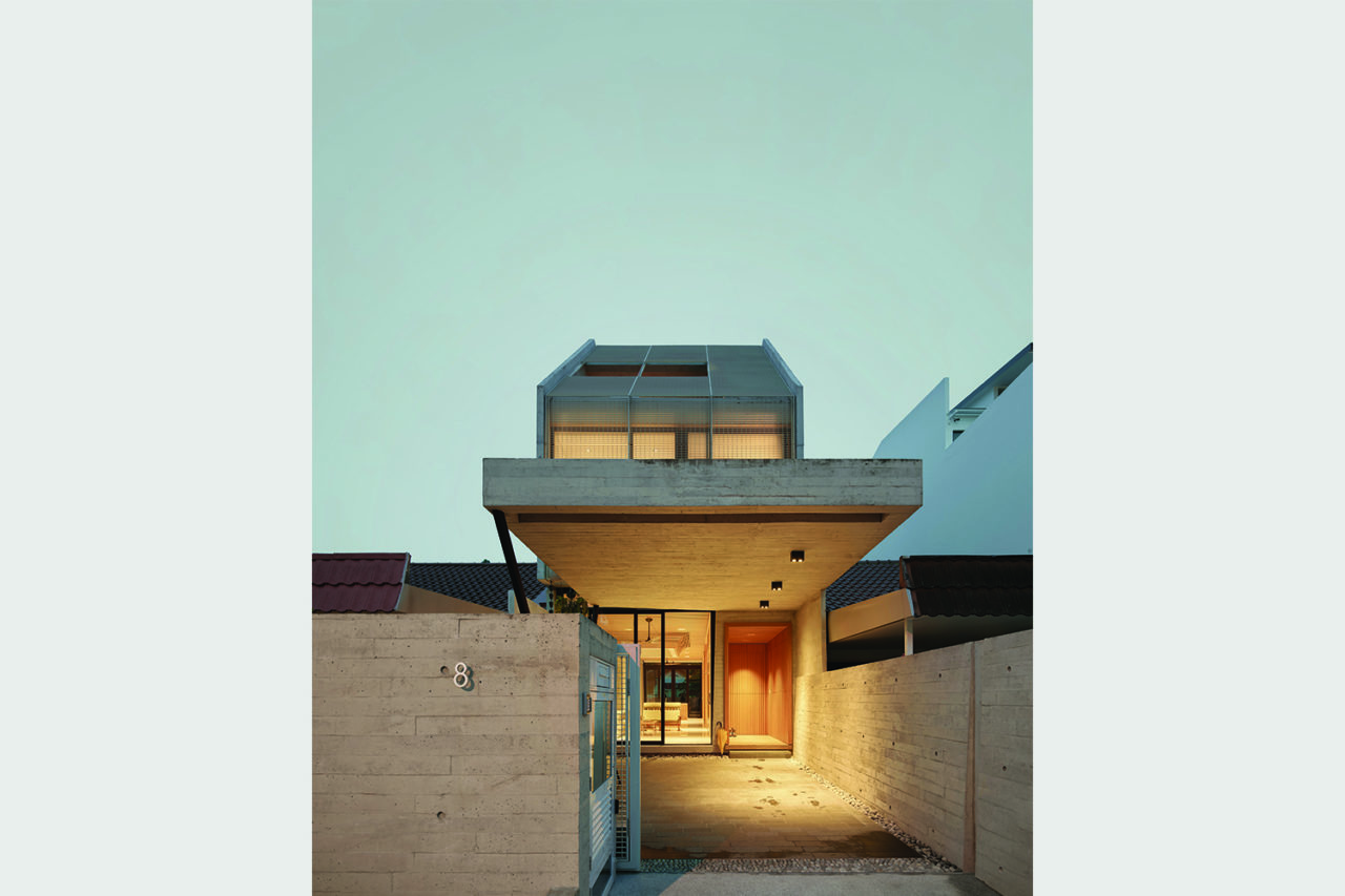 A Simple Terrace House, West elevation at dusk, Singapore. Photo: Kevin Scott.