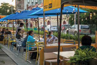 DineOut NYC, a communal-dining prototype designed pro bono by Rockwell Group, has been installed in Manhattan's Chinatown (above left) and in Elmhurst (above right), as well as in other areas of Queens and the Bronx. Photo: Emily Andrews for Rockwell Group.