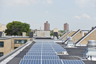 Energy-efficiency improvements at the Marcus Garvey Apartments in Brownsville, Brooklyn, added solar panels and a storage battery to the affordable housing complex. Managed by Enel X, the power system generates 1.1 megawatts, cutting down on renters' energy costs. Photo: Courtesy of Enel X.