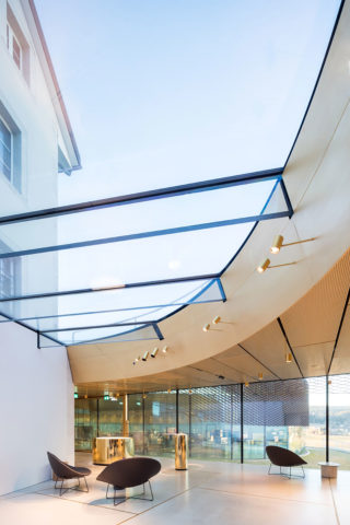 Musée Atelier Audemars Piguet, Architect: BIG – Bjarke Ingels Group. Architect of Record: CCHE. Landscape Architect: Muller Illien Landschaftsarchitekten. Location: Le Brassus, Switzerland. Photo: Iwan Baan.