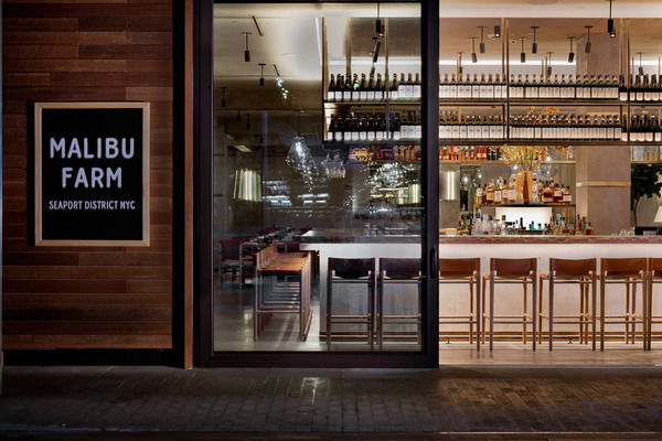 Malibu Farm, Pier 17, New York, NY. Mancini was the architect-of-record for this restaurant at Pier 17, aimed at translating the California-based “Malibu-chic” design aesthetic for the NYC market. The design takes full advantage of views of the Brooklyn Bridge by creating an indoor/outdoor space with two facades that fully open to a patio. Credit: Matthew Mysel.