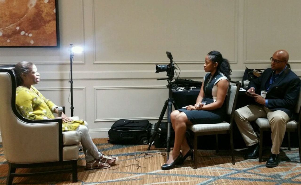 Pascale Sablan and Joel Avery taking testimonials of Rene Kemp-Rotan at the NOMA National Conference. Photo: Courtesy of Pascale Sablan.