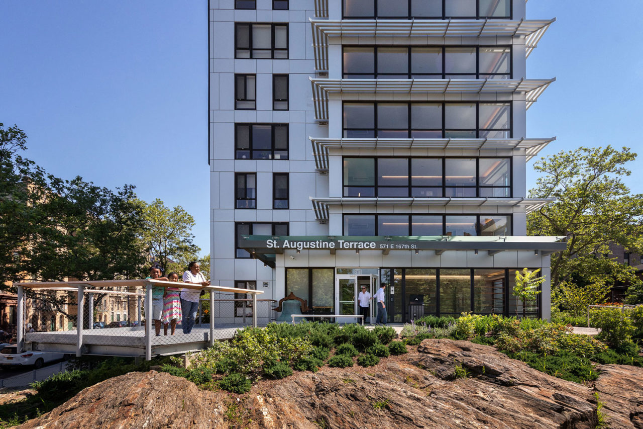 St. Augustine Terrace, Bronx, NY. Affordable and supportive housing, view of main entrance and terrace landscape over rock formations. Photo: David Sundberg/Esto.