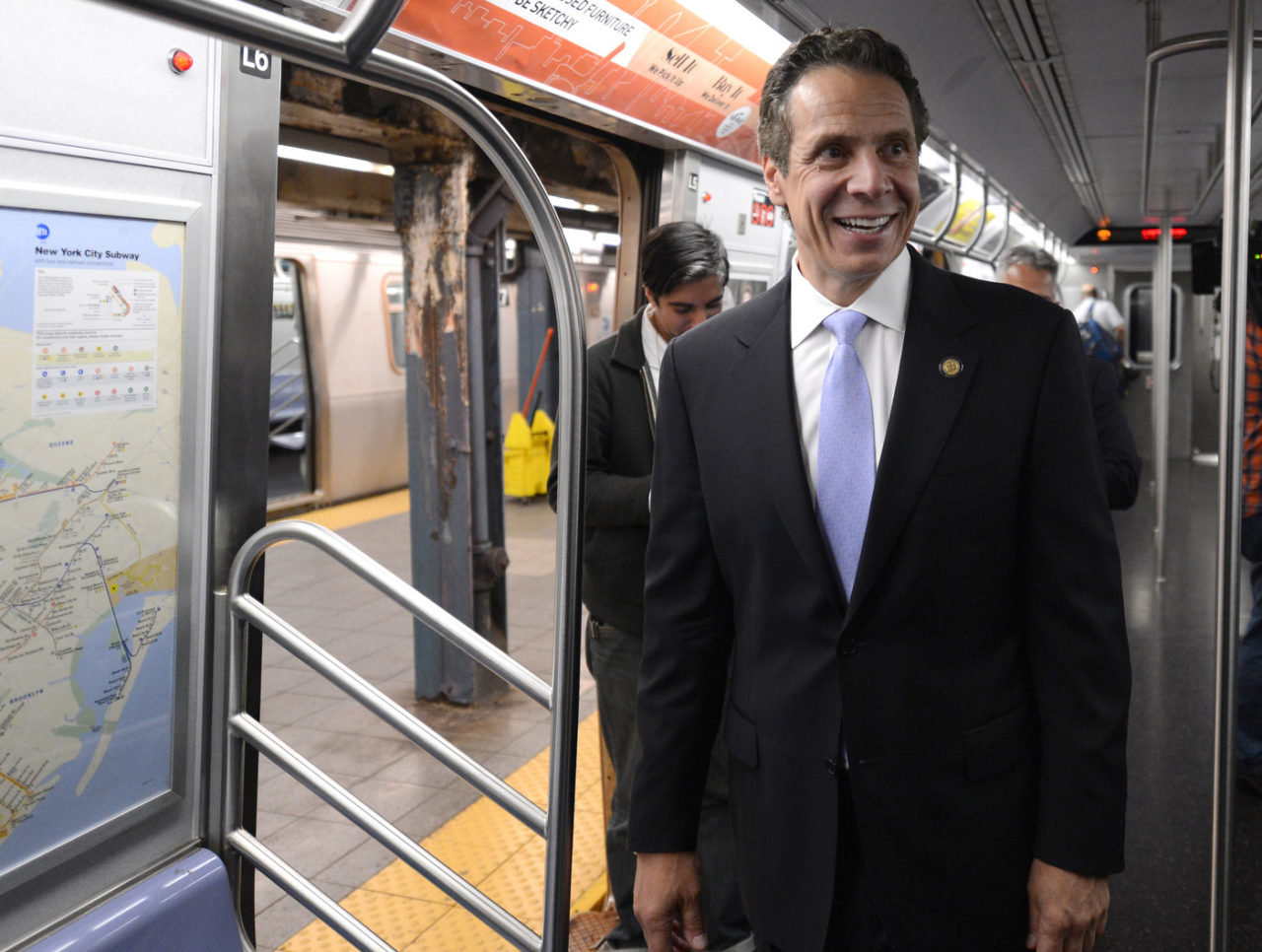 A photo of former New York State Governor Andrew Cuomo riding the E train in New York City.