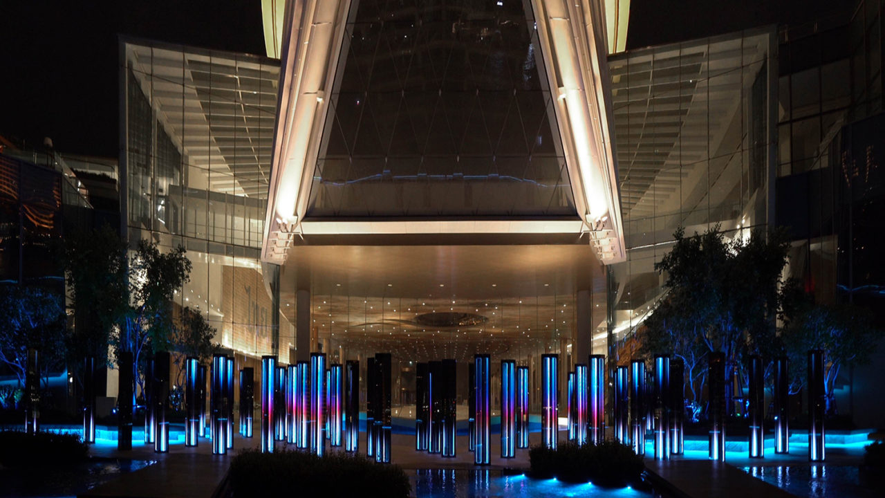 A photo of "Infinity Field" by SOFTlab, with the chambers lit up at night.