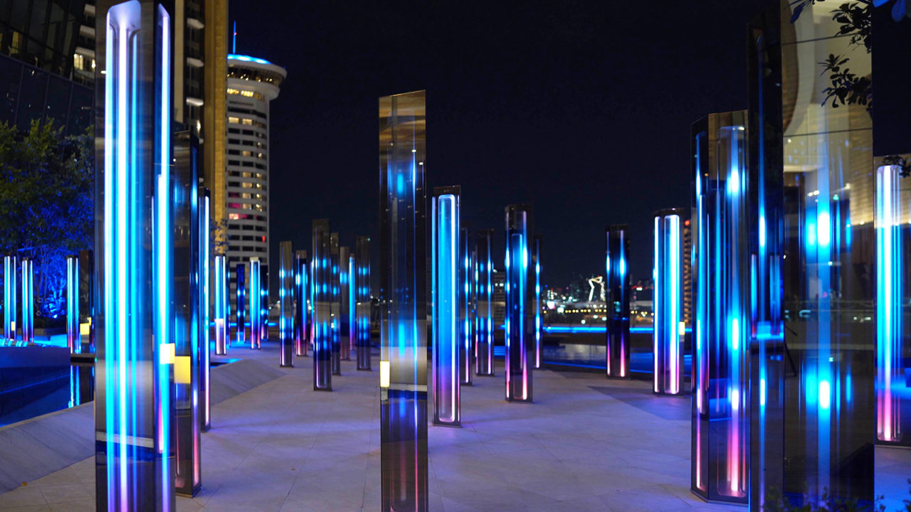 A photo of "Infinity Field" by SOFTlab, with the chambers lit up at night.