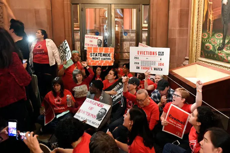 Photo of people protesting for tenants' rights.