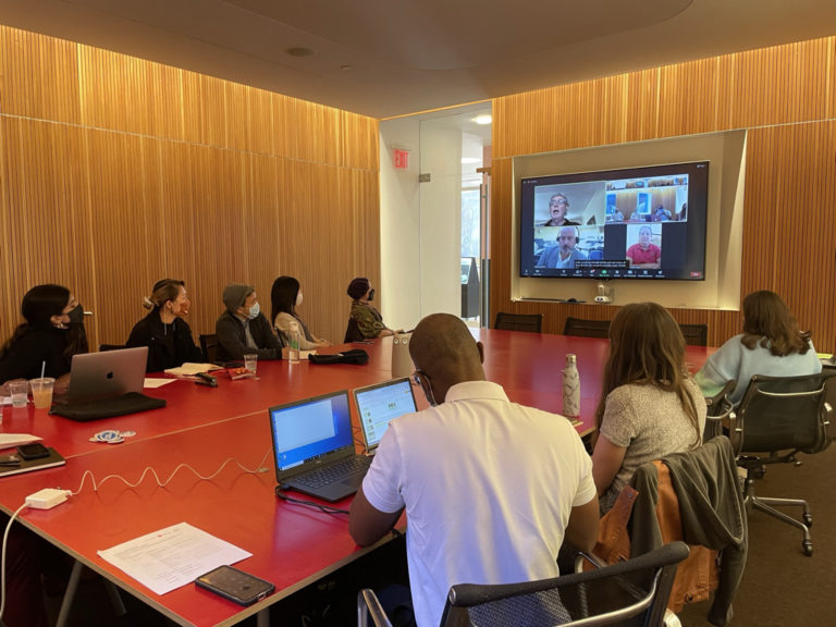 Photo of CLP participants listening to a virtual presentation about NYC's parks system at a conference room at the Center for Architecture.