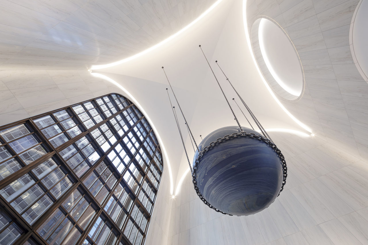 Photo of 550 Madison lobby renovation, focusing on blue stone sphere.
