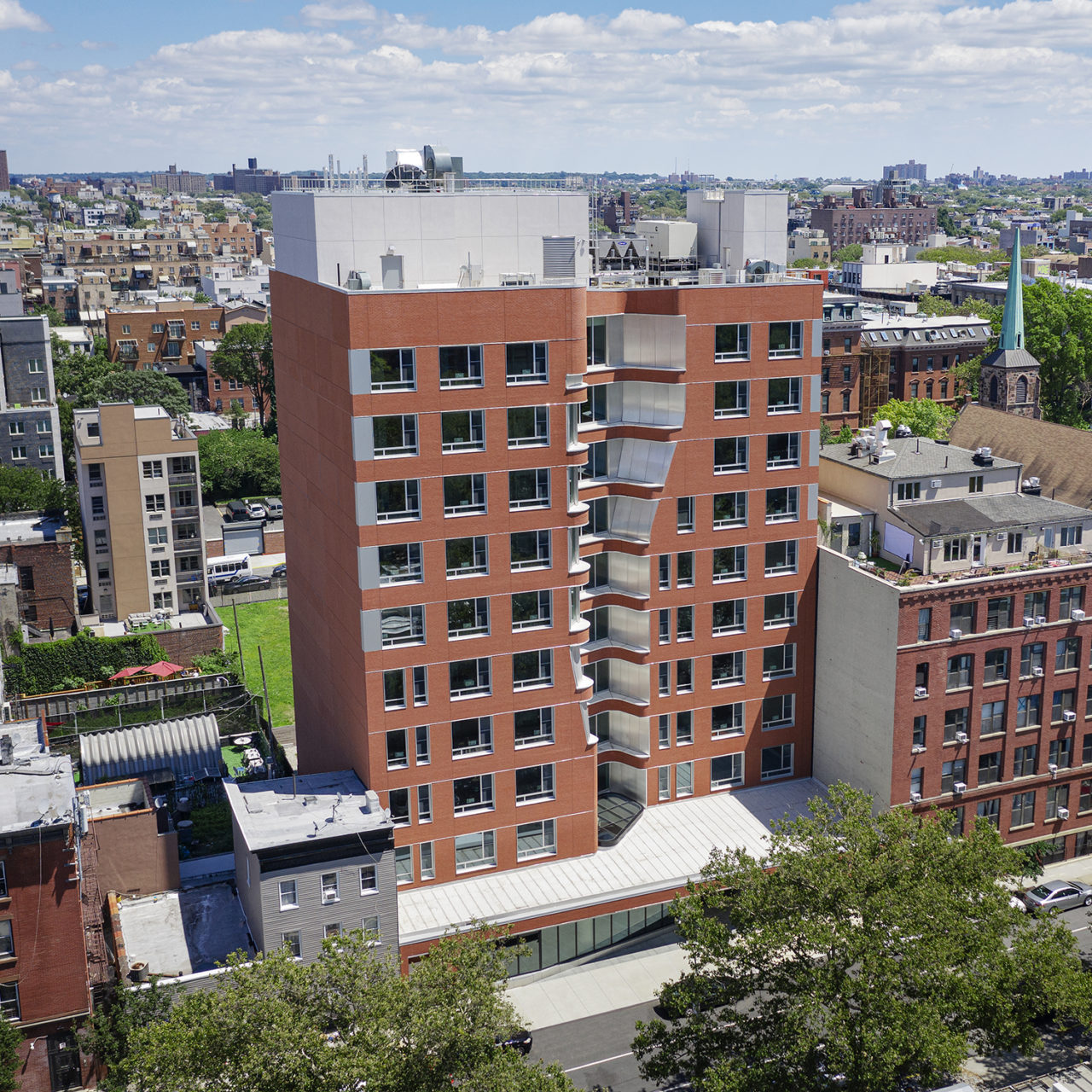 Exterior photo of Emerson Place, featuring the dorm's two brick towers.