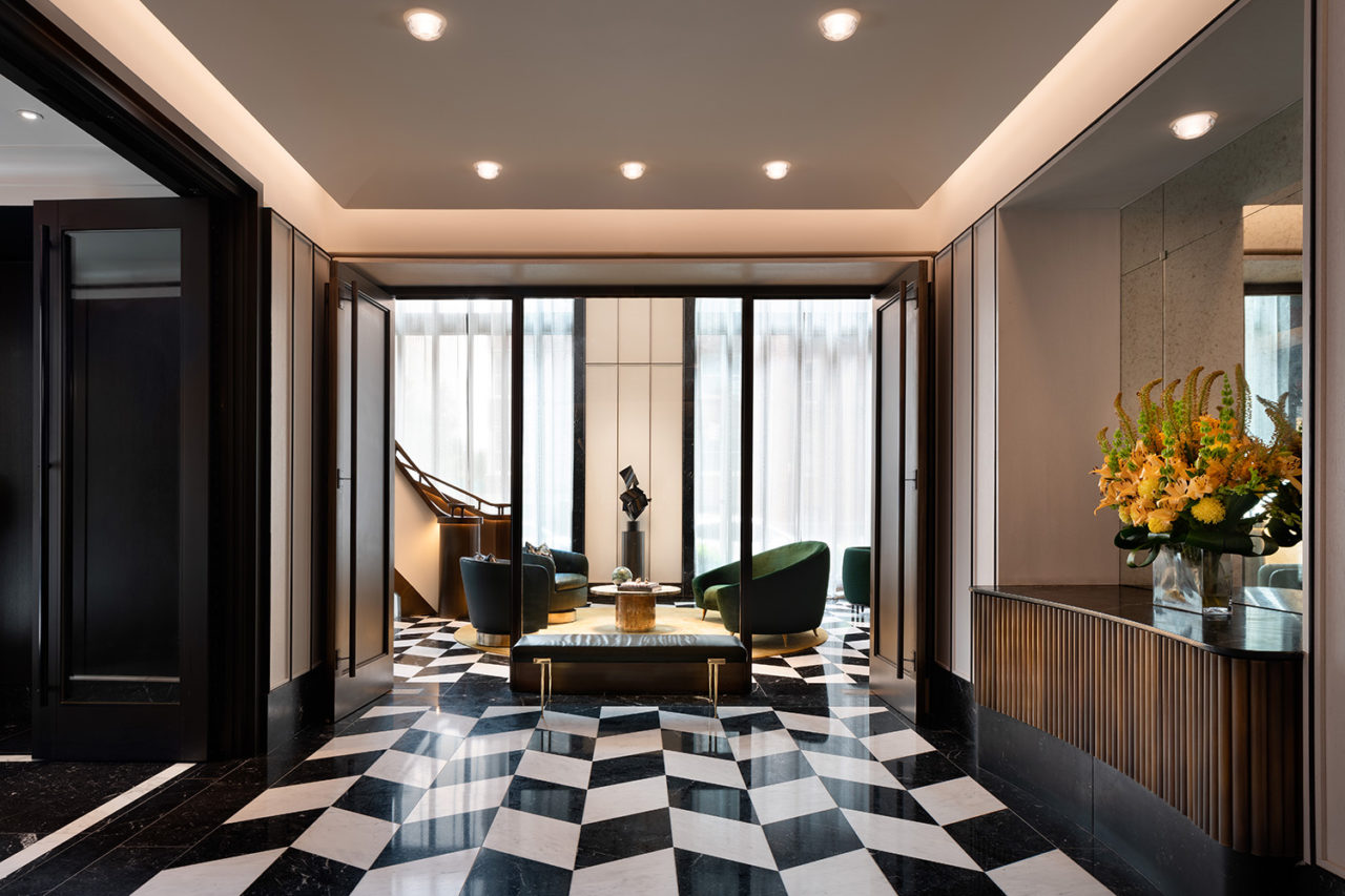 Photo of the lobby at 40 East End, featuring black and white tile floors.