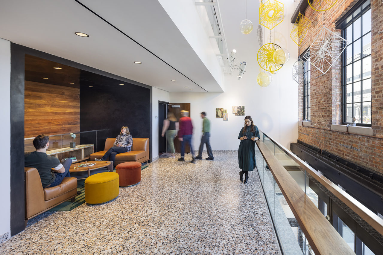 Photo of a mezzanine space with lounge seating at the Irish Arts Center by Davis Brody Bond.