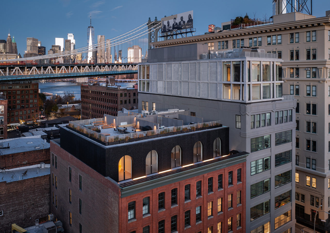 167 Plymouth against the skyline, featuring Brooklyn Bridge.