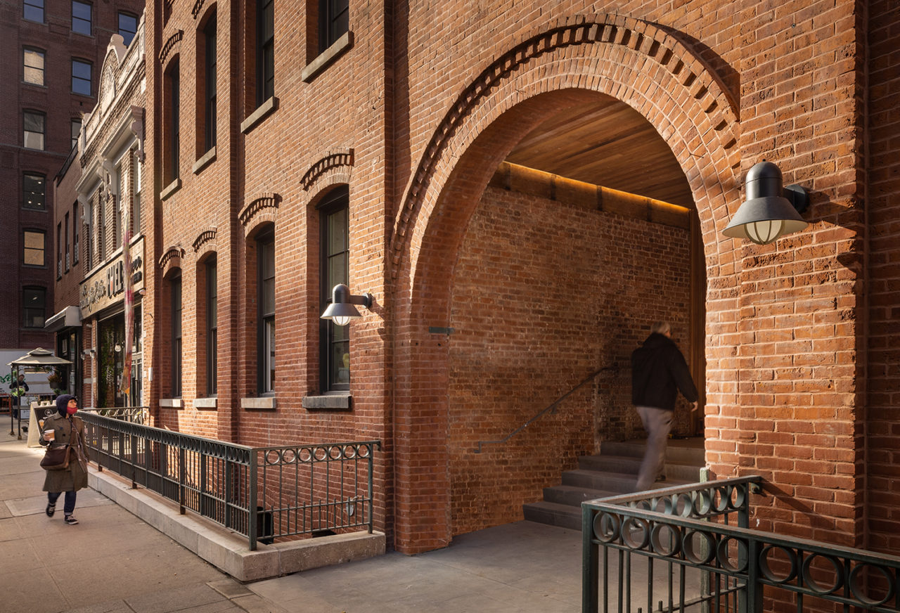 The entrance of 168 Plymouth, featuring a brick arch.