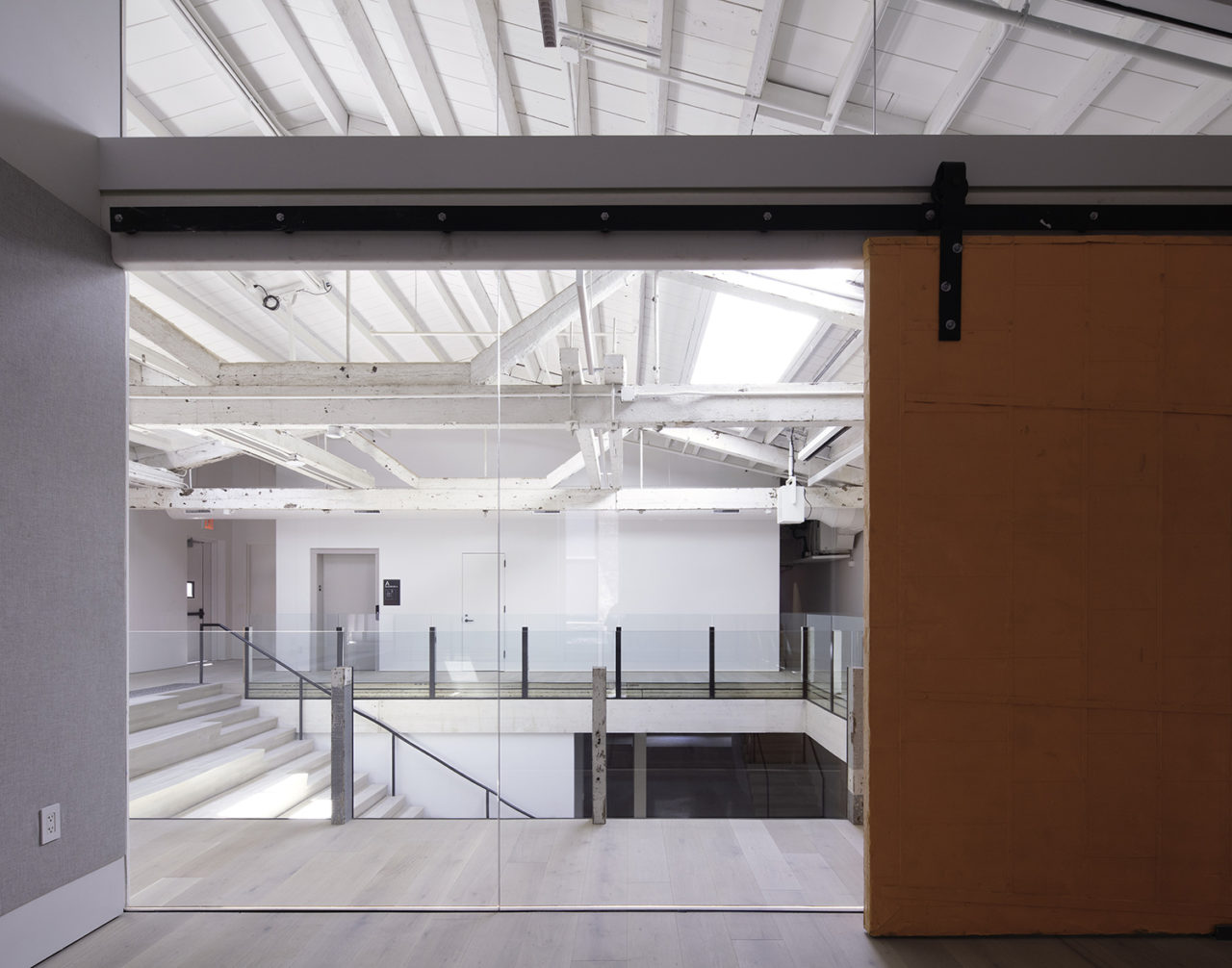 Interior of The Mercury Store, featuring white walls in an industrial space.
