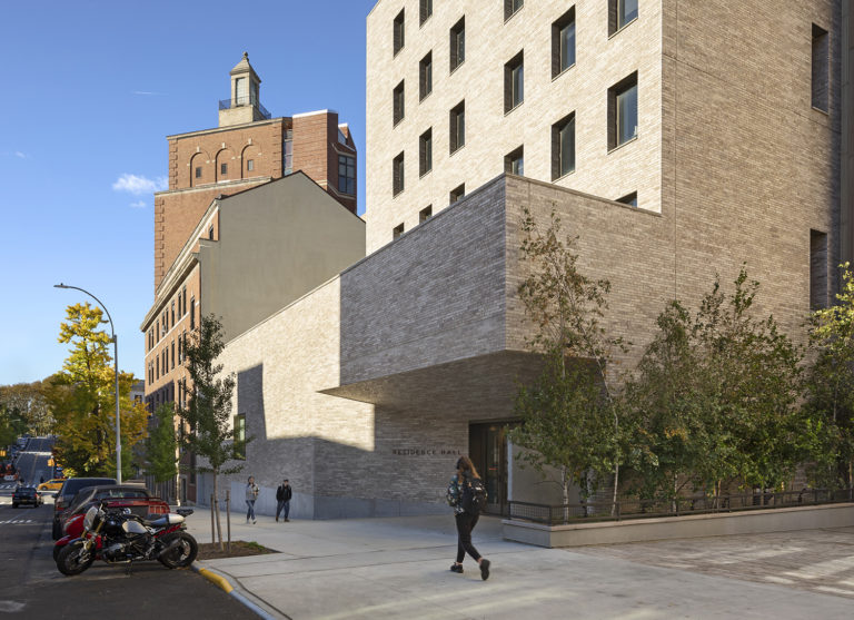 Exterior of the JTS expansion, featuring a white brick facade with a cantilever.