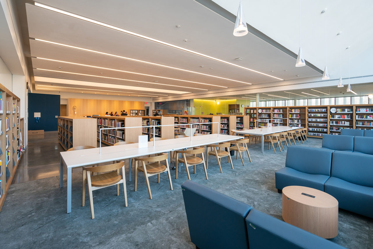Interior of Charleston Branch Library, featuring study area, sitting area, and stacks.