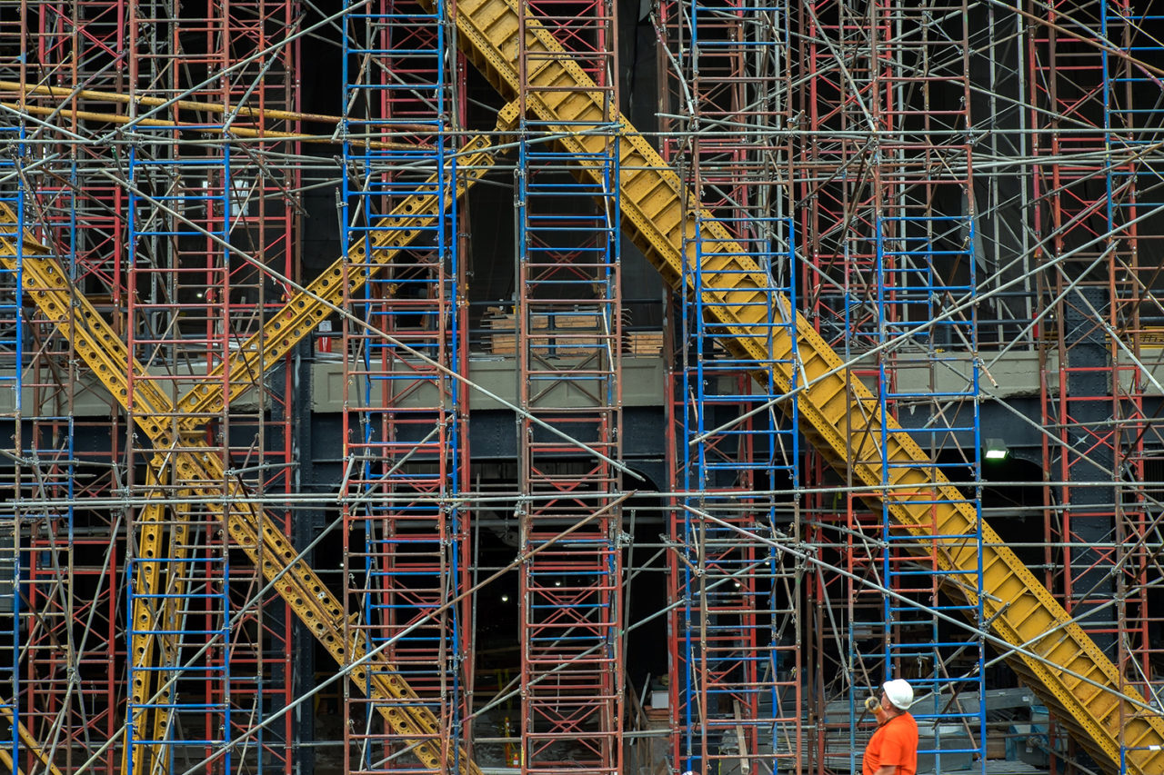 Construction site with worker on the bottom right corner