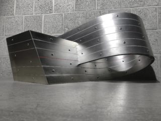 Cameron Wu, Circumvolute 00, 2021. Aluminum fastened to plywood substructure, 18x36x18 inches.