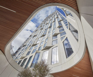 A circular oculus that offers a view of the 11 Hoyt building exterior