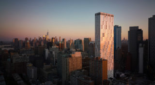 The 11 Hoyt building exterior seen as part of the surrounding city skyline