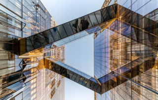 Looking up at the glass-bottomed bridges crossing Pierpoint Lane