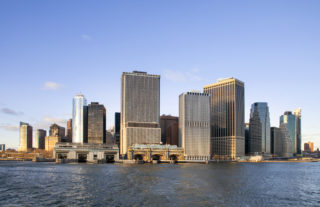 Battery Maritime Building as seen in the distance with the water in the foreground