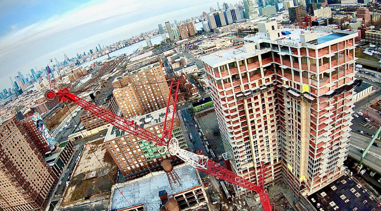 Drone shot looking East over the construction for Hudson House.