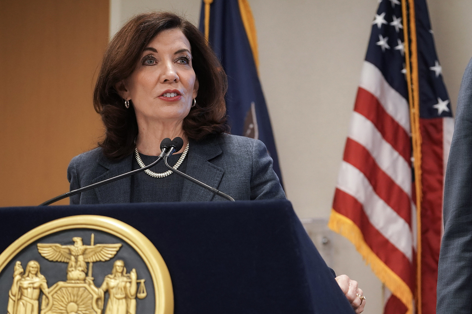 NY Governor Kathy Hochul speaking at a podium