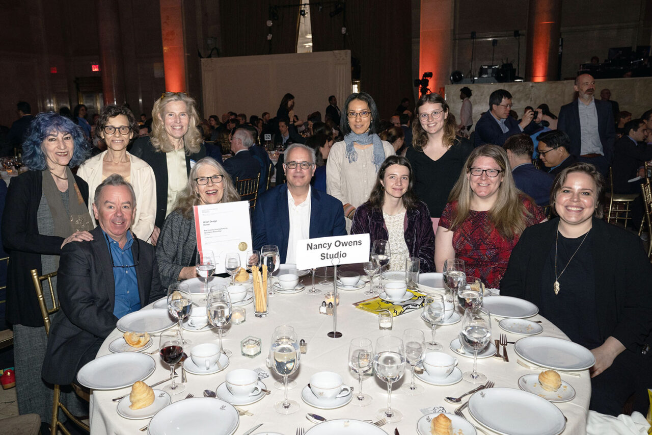 People seated around the table for Nancy Owens Studio at the Honors and Awards luncheon