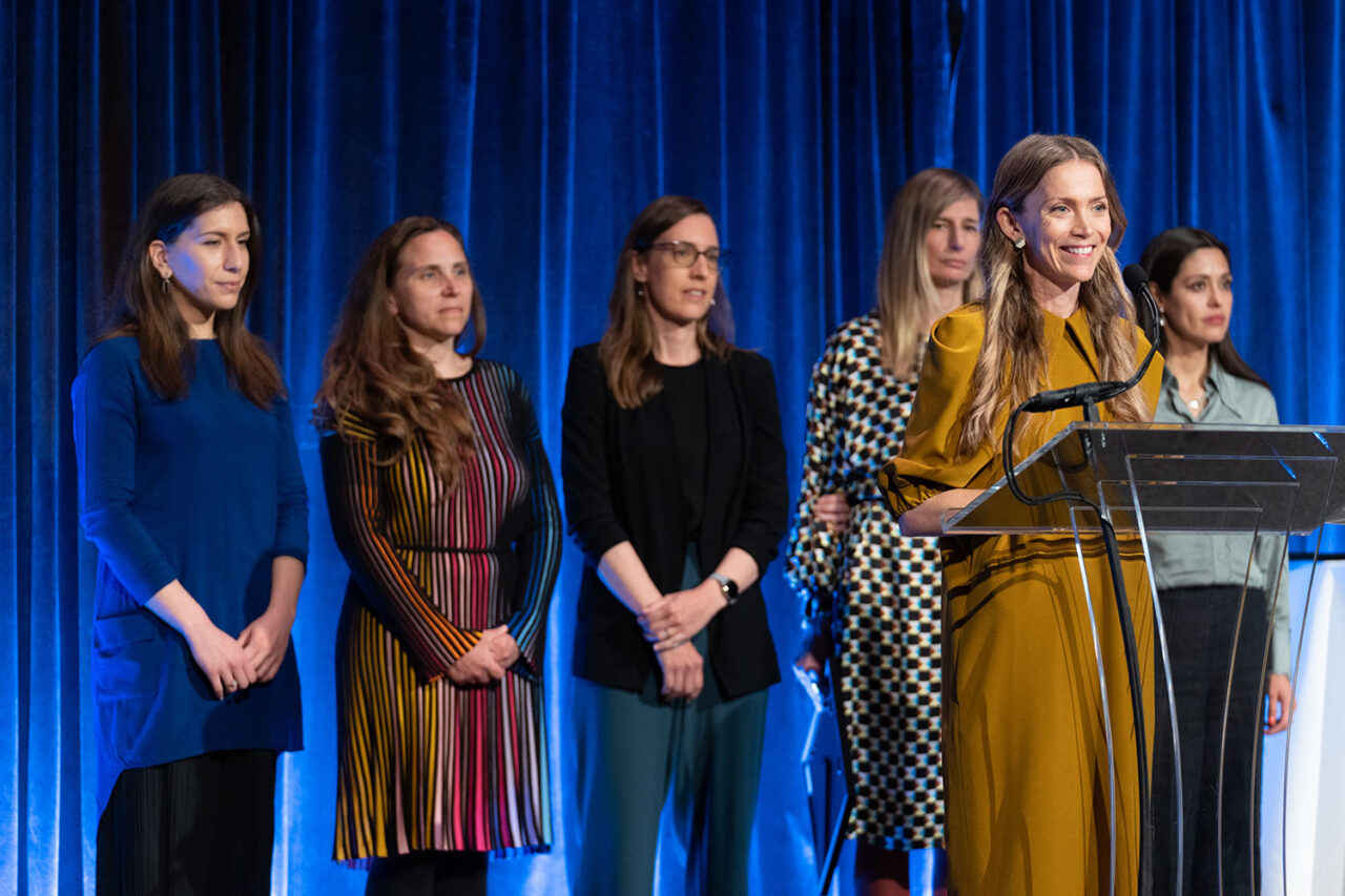 WIP Collaborative on stage at the Honors and Awards Luncheon giving remarks