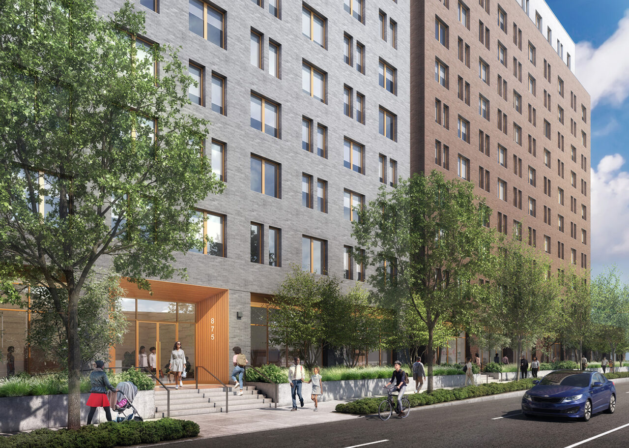 The gray facade of an apartment entrance in Alafia.