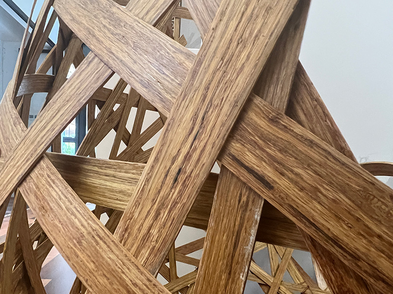 Wide strips of wood woven together