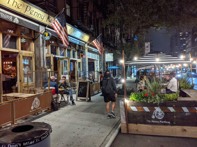 outdoor dining in front of a bar