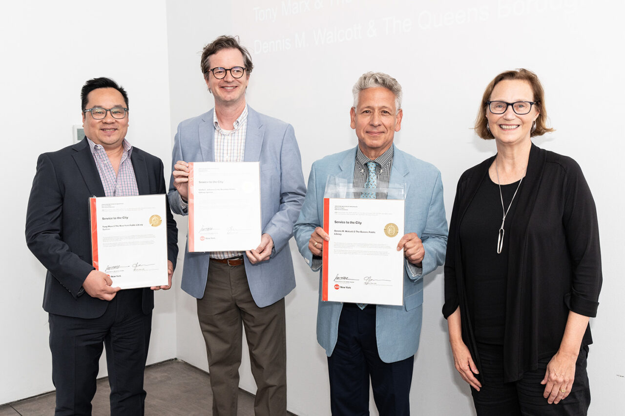 Representatives from the Brooklyn, Queens, and New York Public Library Systems accept the Service to the City Award from Honors Committee member Karen Fairbanks, FAIA
