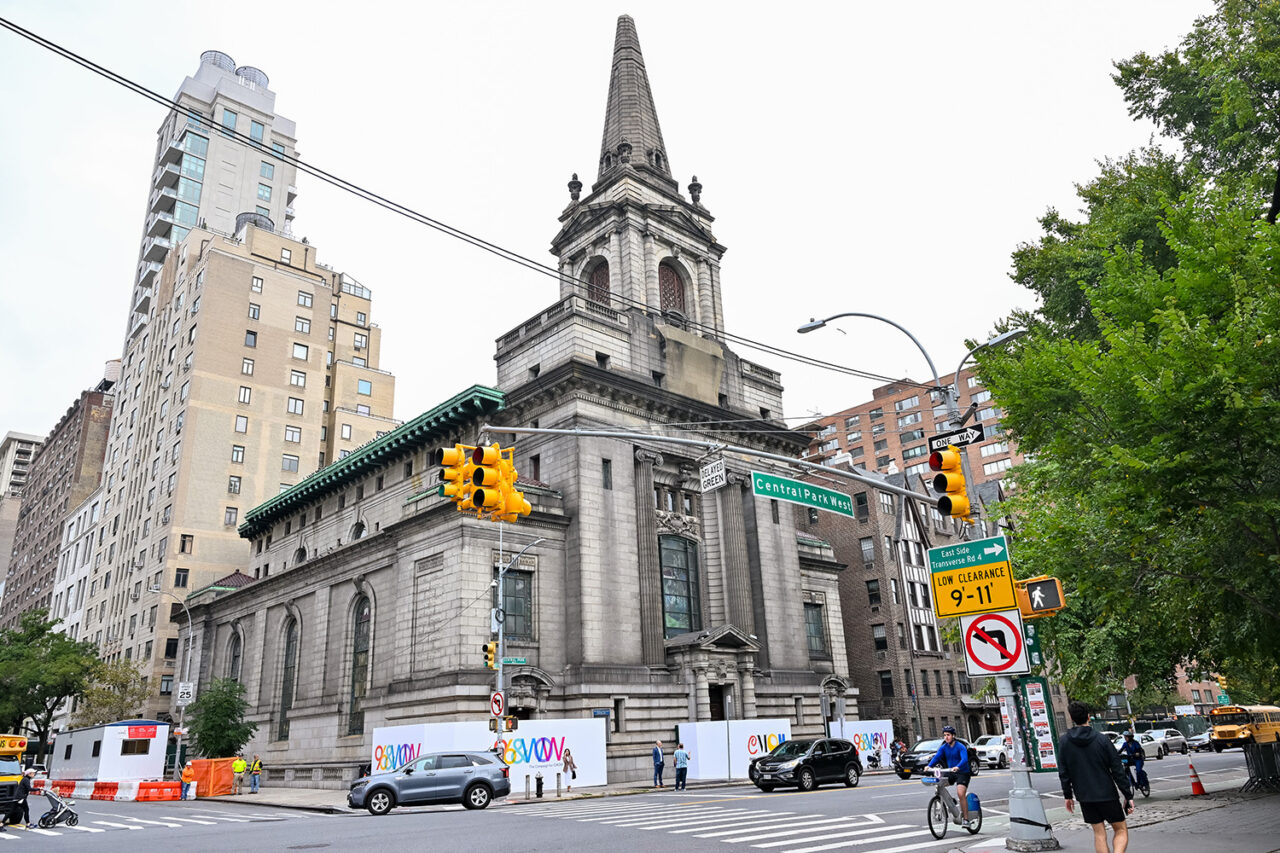 Exterior shot of the Church of Christ, Scientist, a gray stone structure that has a castle-like, cone top.