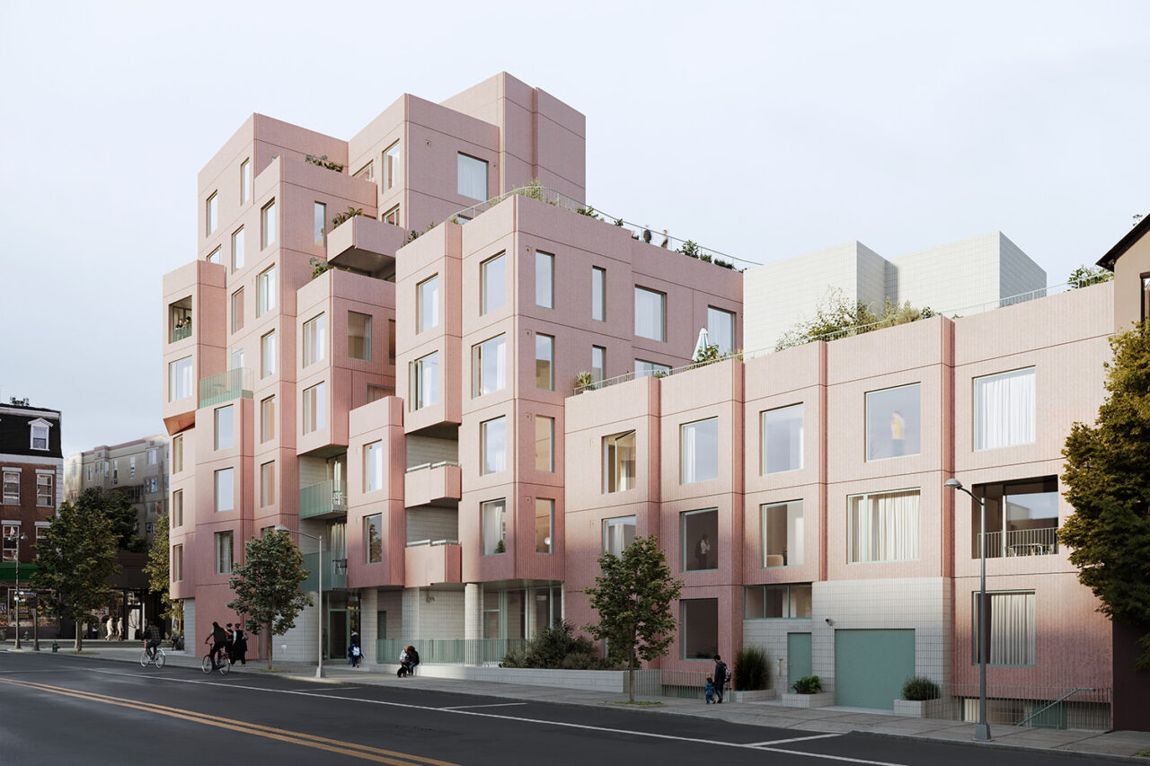Exterior shot of pink condominium with shelled concrete paneling.