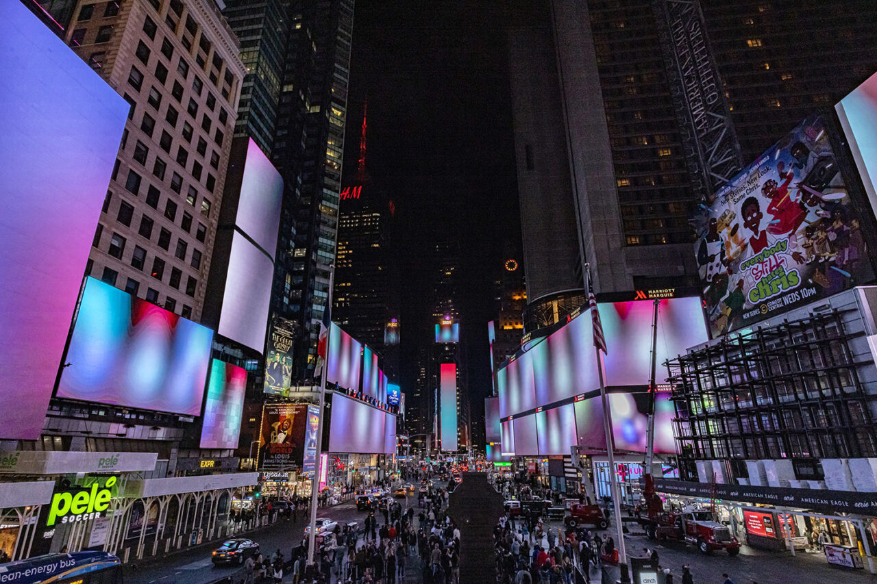 Vibrant abstract color imagery fills the screens of Times Square.
