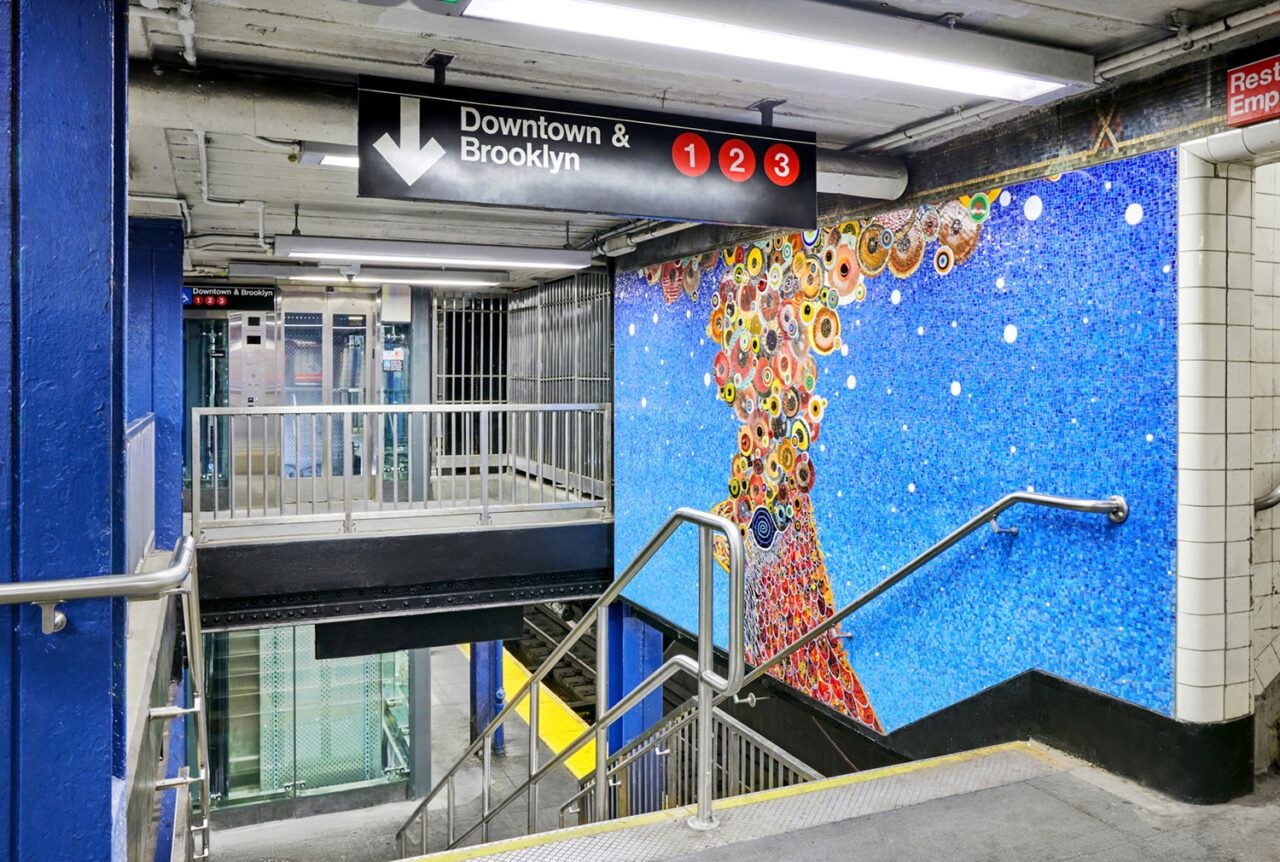 The stairway leading up the elevators at the 14th Street subway station.